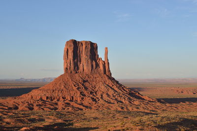 Scenic view of rock formations against sky