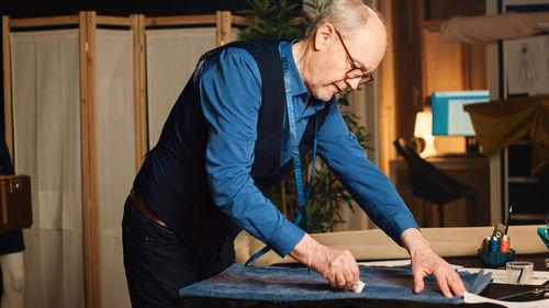 Side view of man working at home