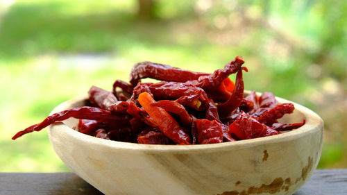 Close-up of red chili peppers in bowl on table