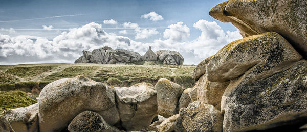 Panoramic view of rock formation against sky