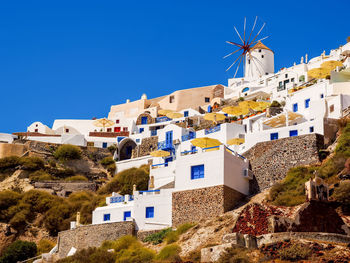 Low angle view of buildings against blue sky