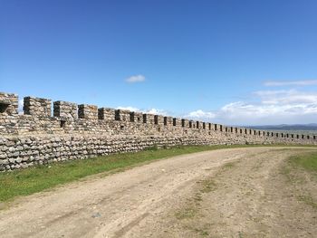 View of old ruins against blue sky