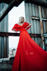 Portrait of a woman with red umbrella