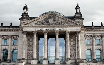 Low angle view of reichstag building against sky