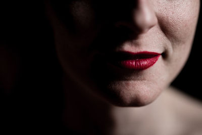 Close-up of woman in darkroom