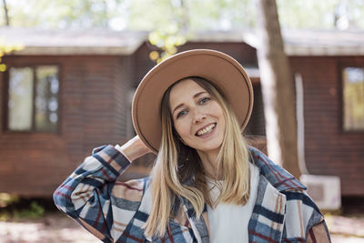 Young stylish caucasian woman 30-35 years old wearing casual clothing shirt and cowboy hat 