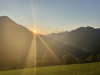 Scenic view of mountains against sky during sunset