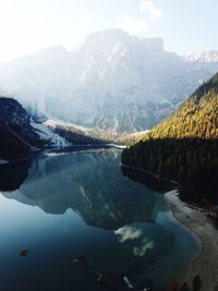 Scenic view of lake and mountains against sky