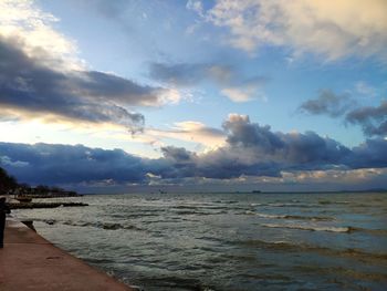 Scenic view of beach against sky during sunset