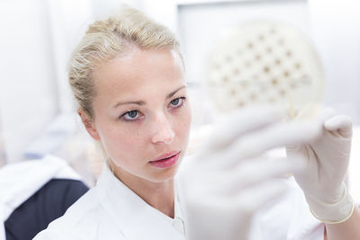 Close-up of woman working in laboratory