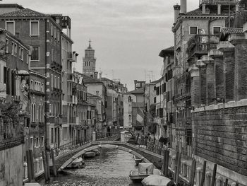 Street amidst buildings in city against sky