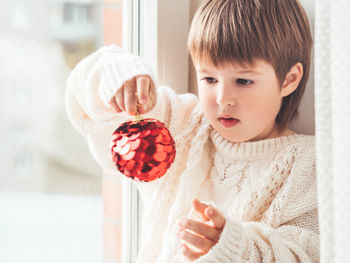 Close-up portrait of boy holding ice cream