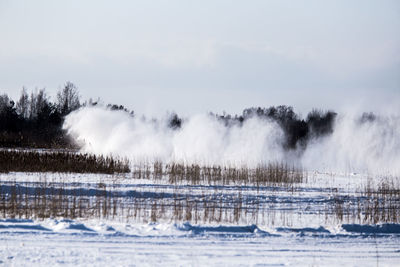 Cars racing on the frozen lake. drifting cars on ice. fun sport in winter.