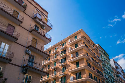 Low angle view of building against blue sky