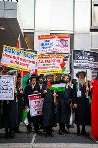 People standing on street in city