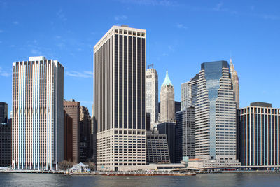 Skyscrapers in city against sky