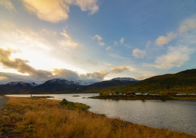 Scenic view of lake and mountains against sky