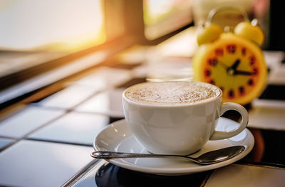 Close-up of coffee cup on table