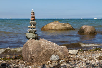 Stack of stones against calm sea