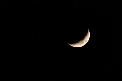 Low angle view of moon against sky at night