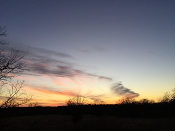 Scenic view of silhouette landscape against sky at sunset