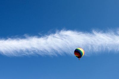 Low angle view of multi colored balloons