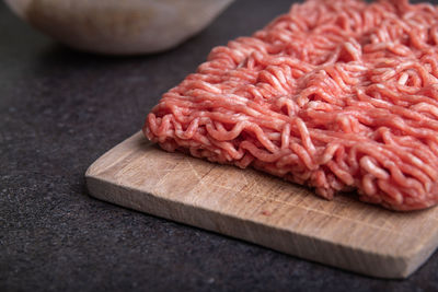 Close-up of meat on cutting board