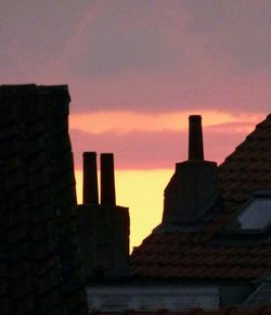 Built structure against sunset sky