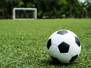 Close-up of soccer ball on field