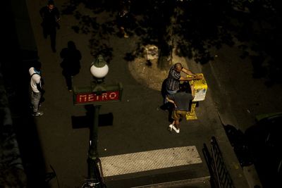 High angle view of people walking on road