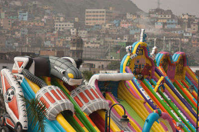 Bouncy playground equipment with cityscape in background