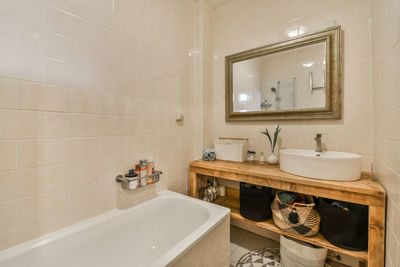 Portrait of woman sitting in bathroom