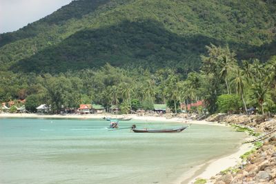 Scenic view of beach against mountains