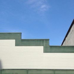 Low angle view of building against blue sky