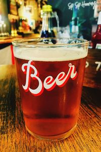 Close-up of beer glass on table