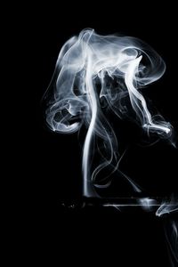 Close-up of smoke against black background