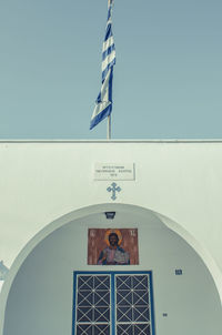 Low angle view of cross against clear sky