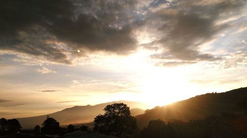 Scenic view of landscape against cloudy sky