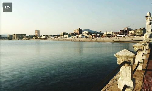 View of buildings by sea