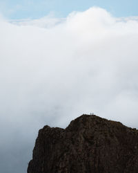 Low angle view of rock formation against sky