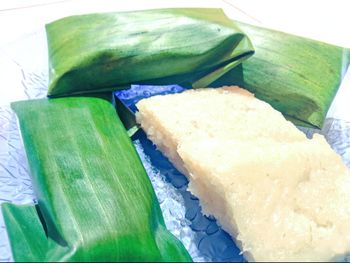 High angle view of meat and leaves on plate