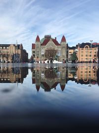 Reflection of buildings in lake