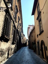 Narrow alley amidst buildings in city