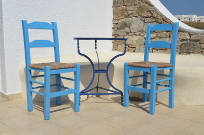Chairs and table on sand