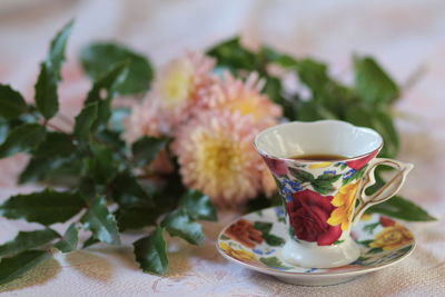 Close-up of roses in pot on table