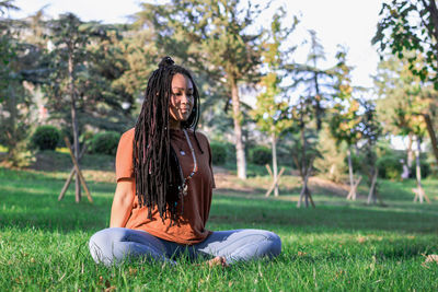 Woman is doing yoga exercise outside in a park. concept of healthy lifestyle.