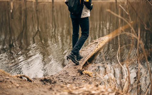 Low section of man standing in rain