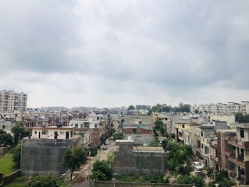 Buildings in city against sky