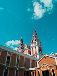 Low angle view of building against blue sky