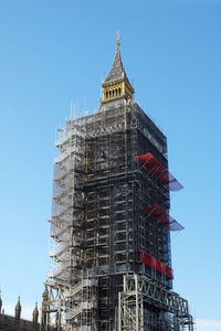 Low angle view of building against blue sky